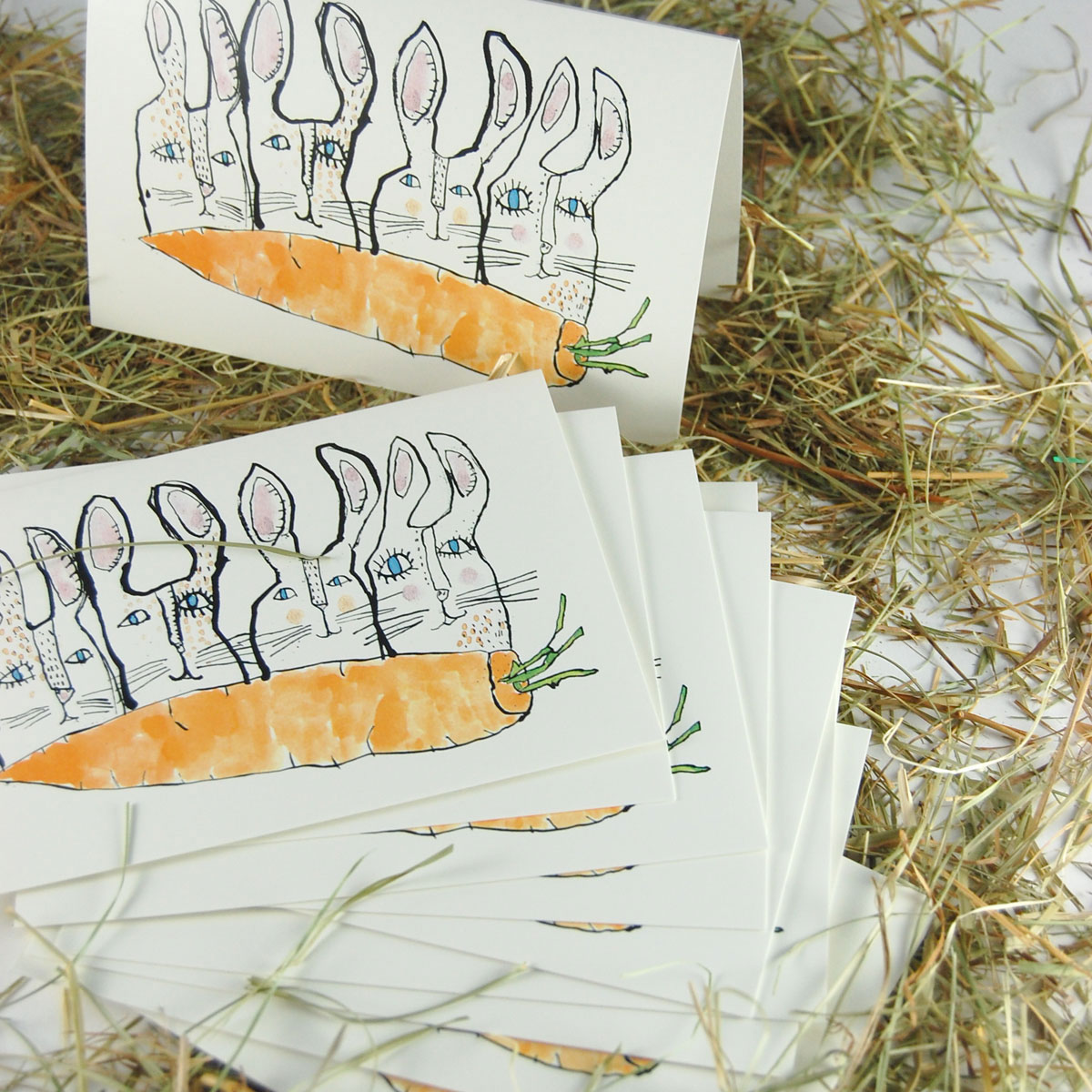 vier Hasen, eine Karotte, k&uuml;nstlerische Osterkarten