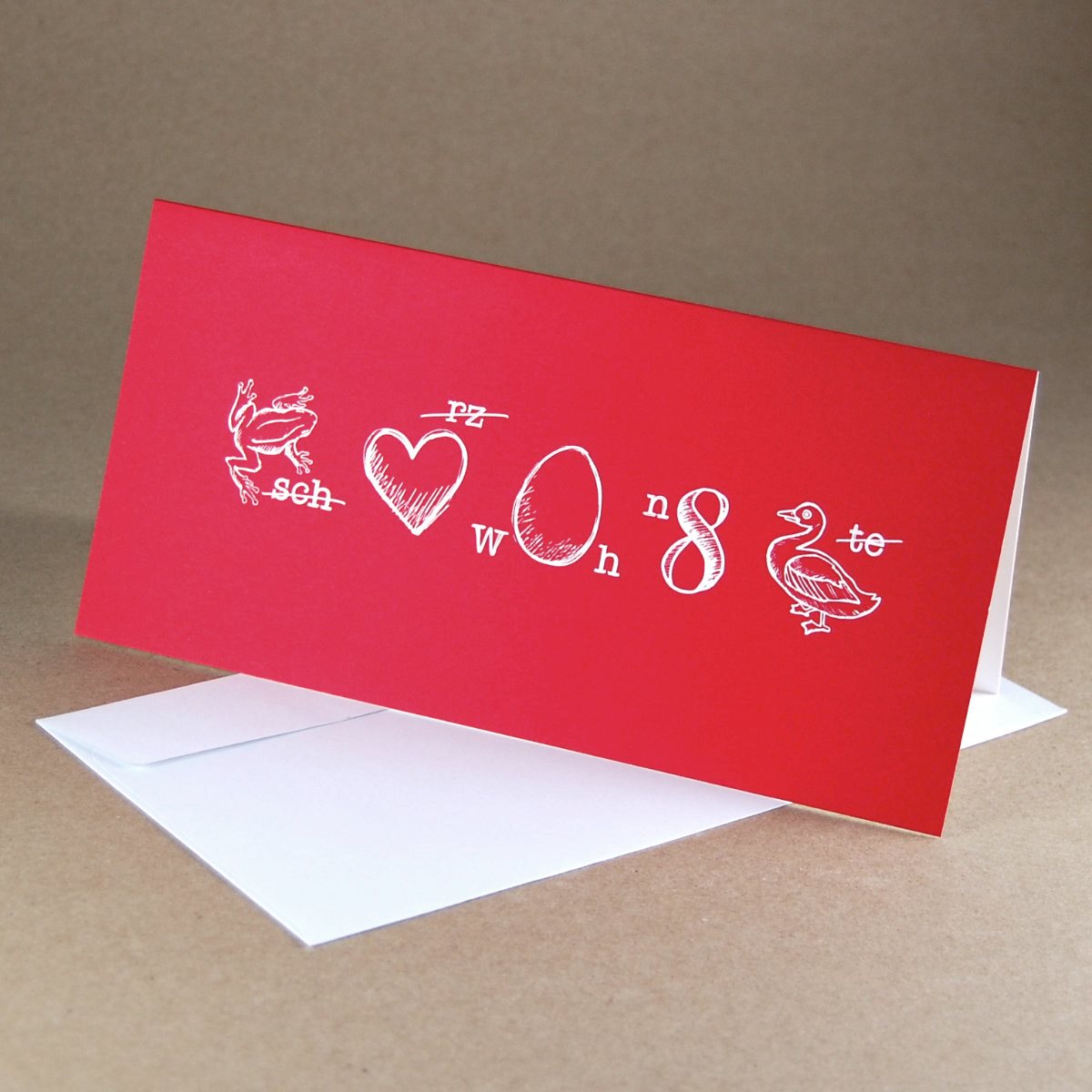 Rebus - rote Weihnachtskarten mit weißen Umschlägen