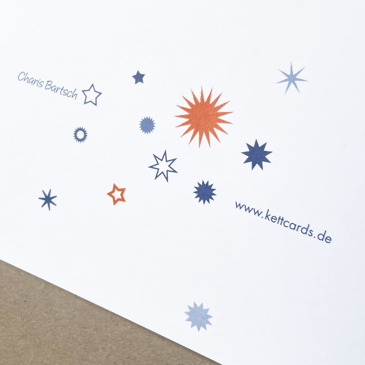 orange und blaue Sterne - Design-Weihnachtskarten in Unternehmensfarben