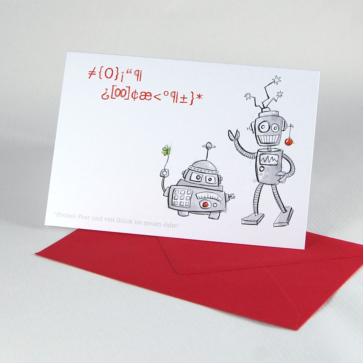 Weihnachtskarten mit roten Umschlägen und sympathischen Weihnachtsrobotern