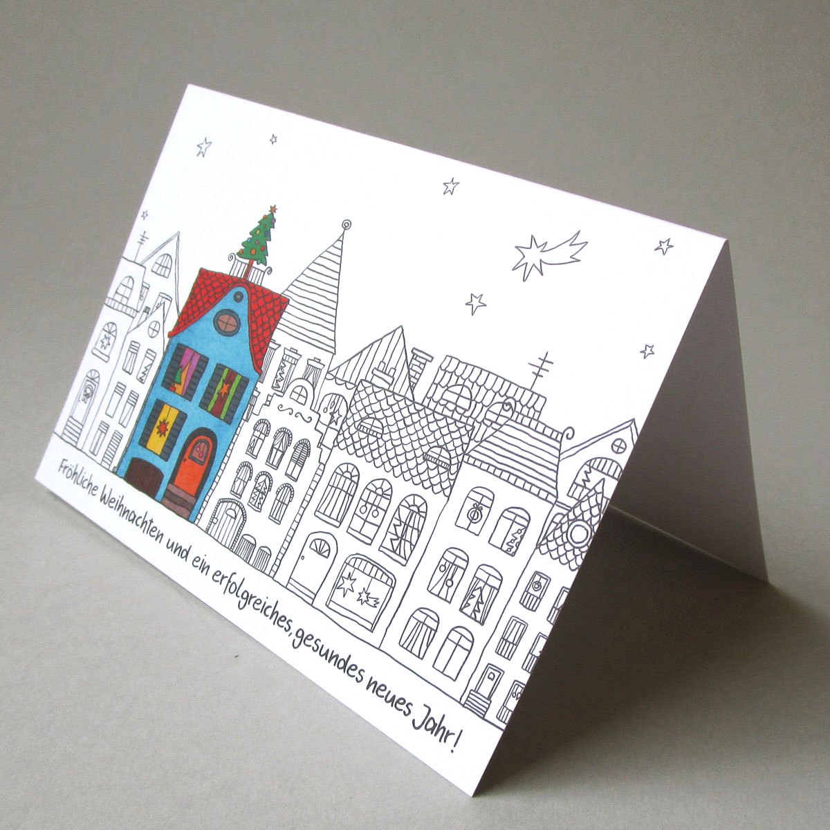 tolle Weihnachtskarten für Handwerker: Stadt mit buntem Haus mit Weihnachtsbaum