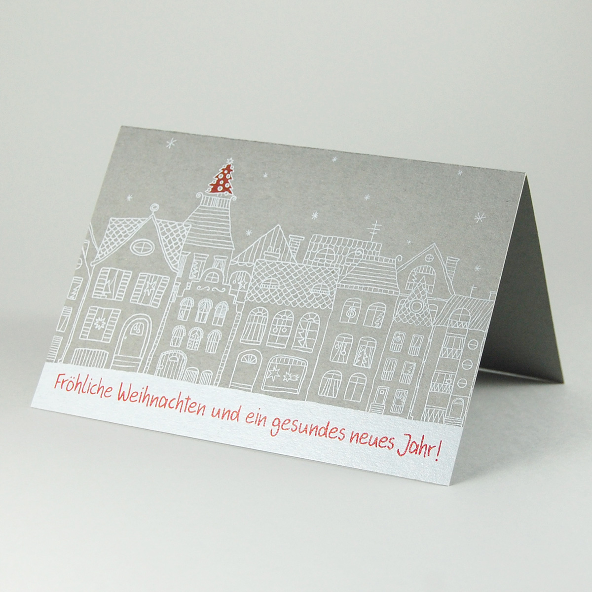 graue Weihnachtskarten mit digitalem weißen Druck: weihnachtliche Häuserzeile