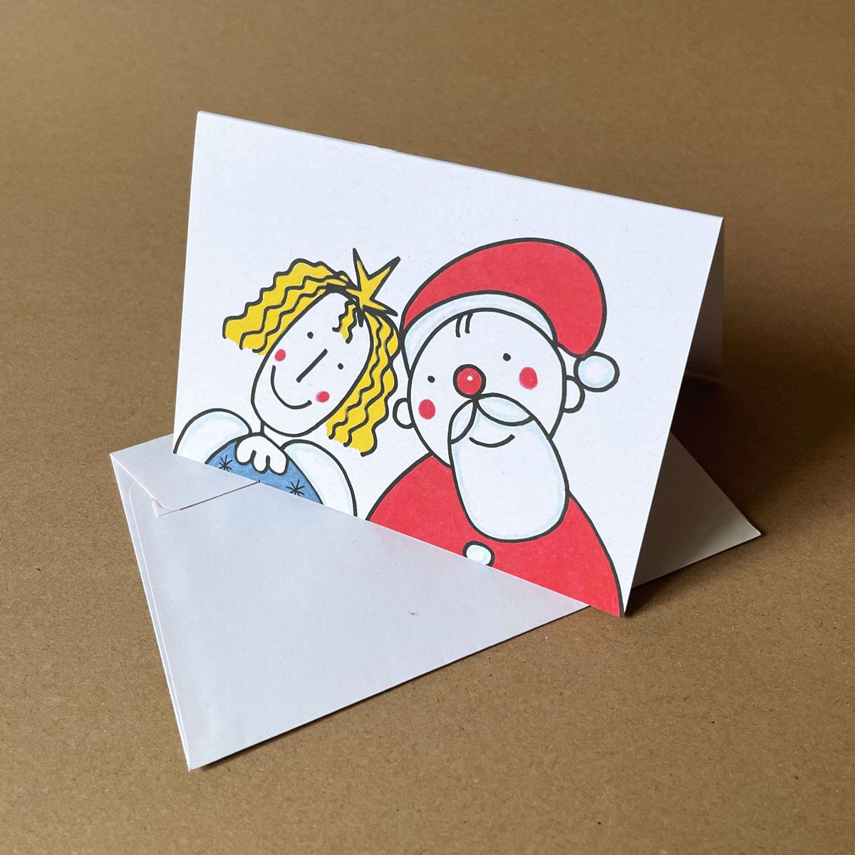 Engel und Weihnachtsmann friedlich zusammen, Recycling-Weihnachtskarten mit Recyclingumschlägen