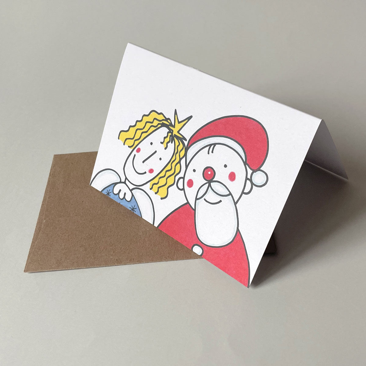 Engel und Weihnachtsmann friedlich zusammen, Recycling-Weihnachtskarten mit Recyclingumschlägen