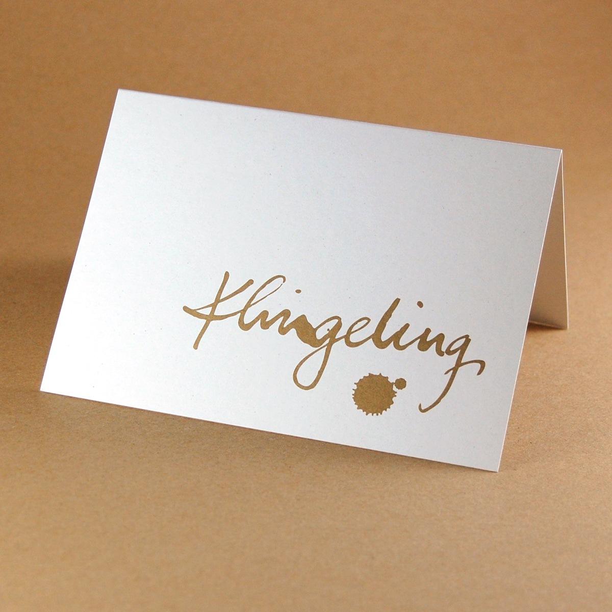 Klingeling, goldene Recycling-Weihnachtskarten mit kurzem Text in Handschrift