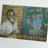 Junge an der Schul-Tafel, Spenden-Weihnachtskarten
