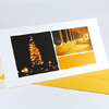 Weihnachtskarte mit weihnachtlichen Lichtern in Orange-Tönen